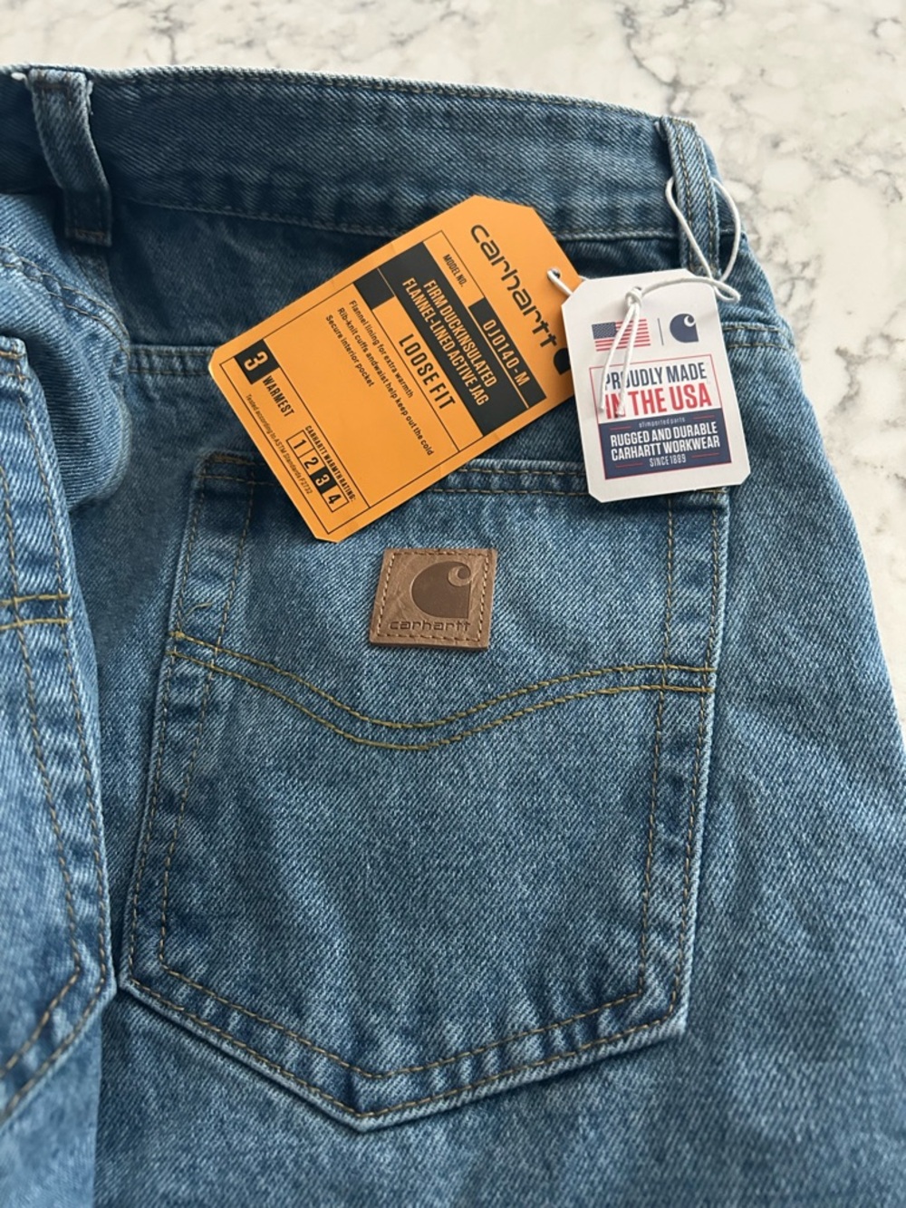 Carhartt Men's Light Blue Relaxed Jeans with Leather Patch